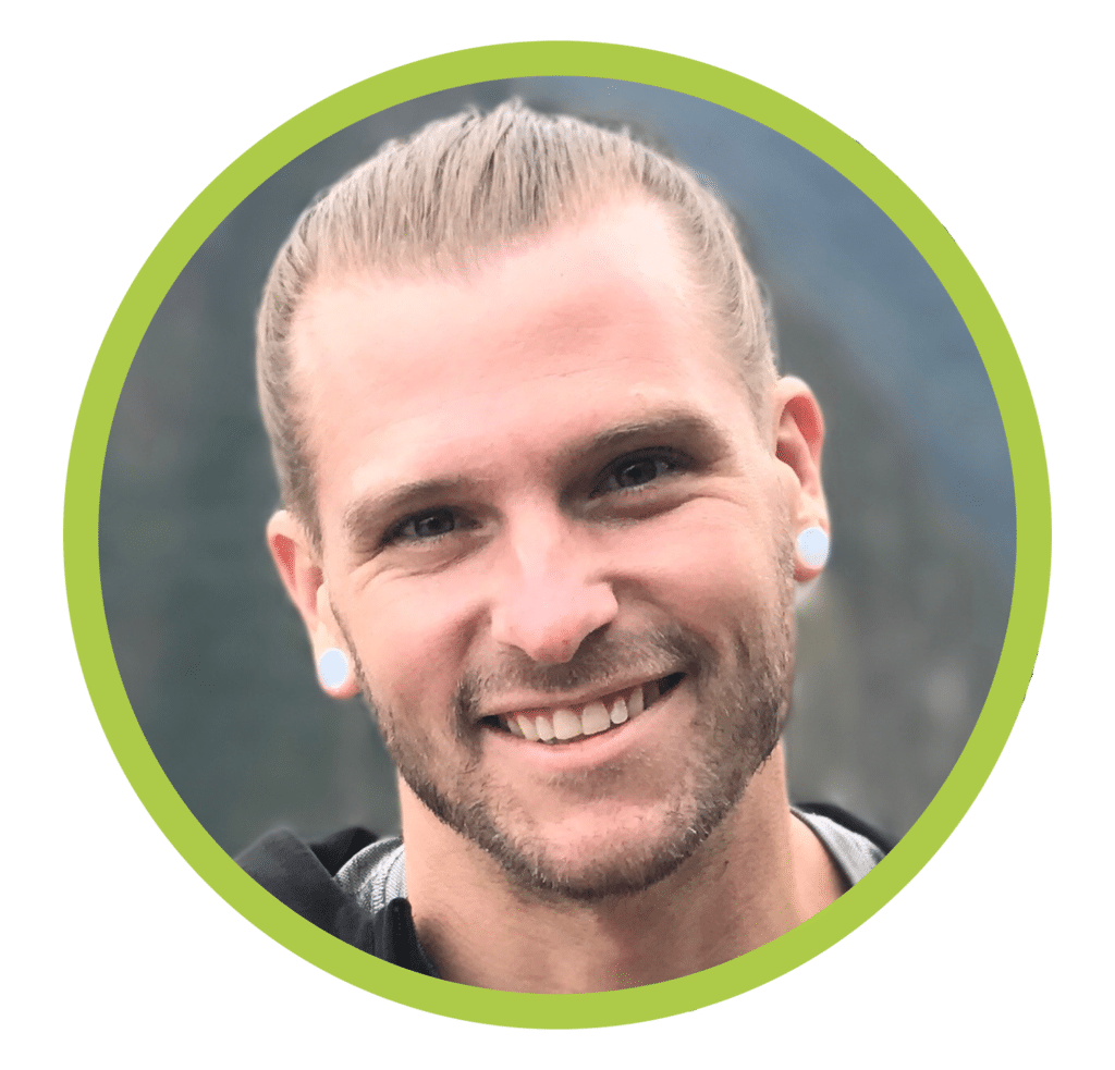 Headshot of Coach Kyle Weiger smiling with tied hair