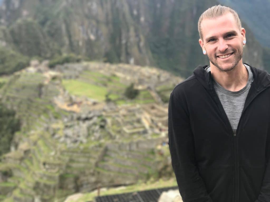 Photoshoot of Coach Kyle Weiger wearing a Hoodie with Mountain in the Background