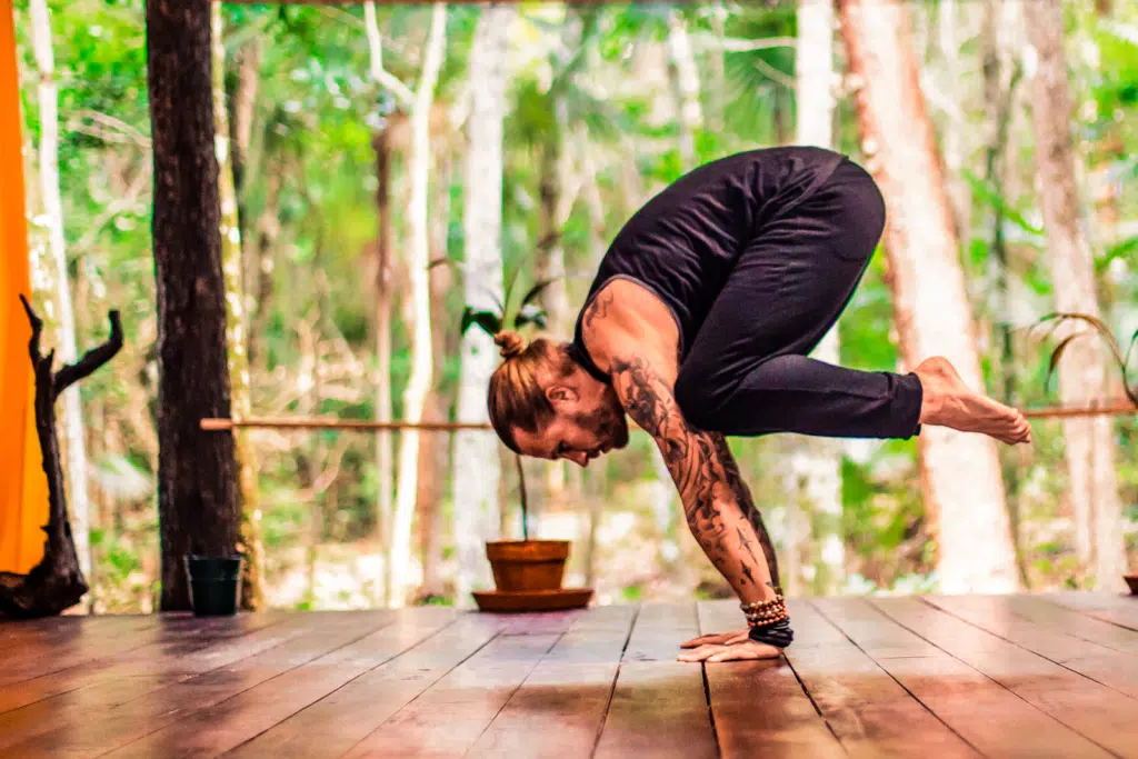 How To Do A Handstand Easy Course cover with Coach Kyle Weiger doing a Crane Position with a tropical background