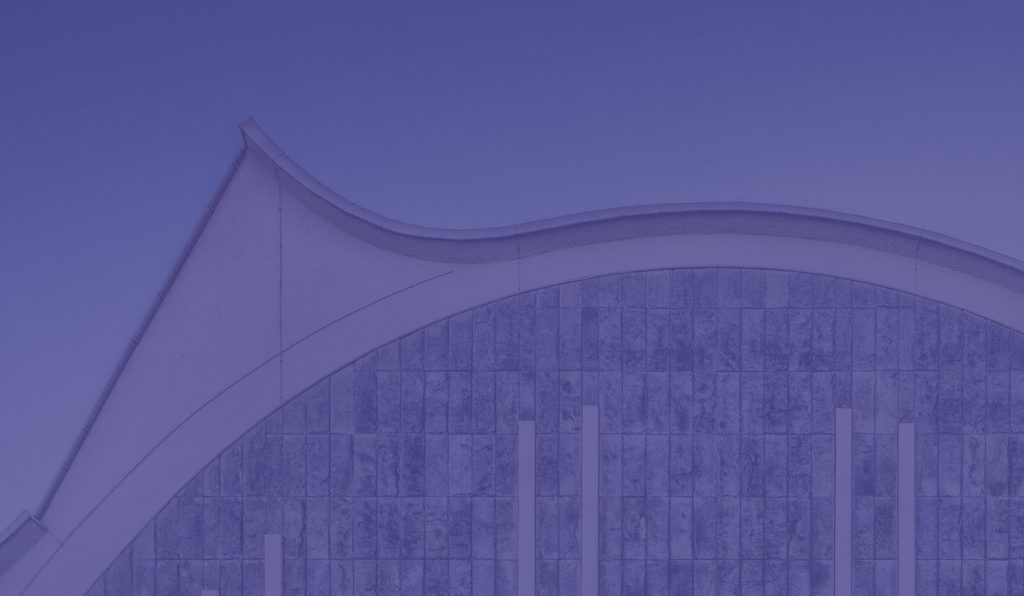 Curved roof gutter and tiled wall with blue filter