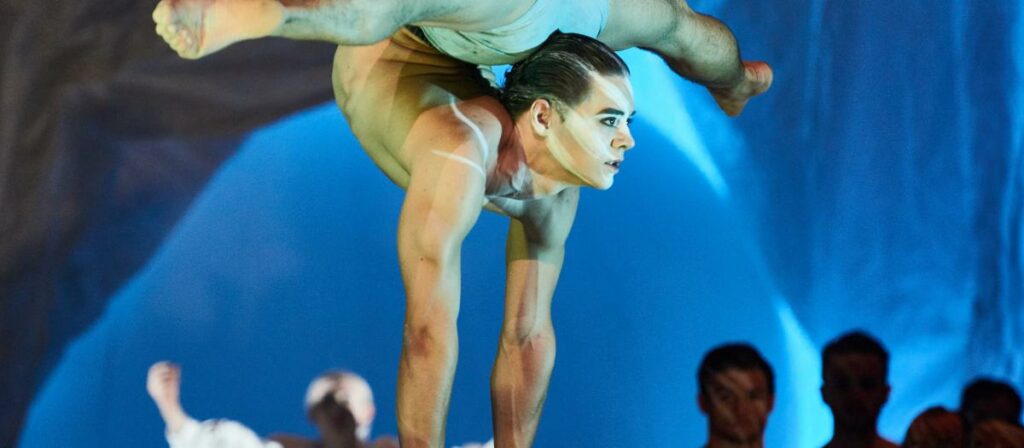 Circus Artist Kyle Cragle handstanding butt and head touching and legs split