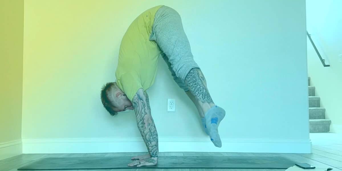 Handstand Press with feet lifted off ground.